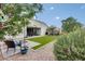 Backyard showcasing the manicured artificial turf, patio, and outdoor seating arrangement at 35773 N Loemann Dr, San Tan Valley, AZ 85143