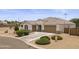 The aerial showcases a well-maintained front yard and a spacious driveway leading to the two-car garage at 35773 N Loemann Dr, San Tan Valley, AZ 85143