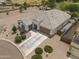 Aerial view of the front exterior with a well-maintained driveway and a two-car garage at 35773 N Loemann Dr, San Tan Valley, AZ 85143