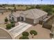 An aerial view shows the home's front exterior with a well-kept yard and a convenient two-car garage at 35773 N Loemann Dr, San Tan Valley, AZ 85143