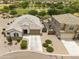 An aerial view shows the home's exterior, and landscaping, and it's proximity to the community park at 35773 N Loemann Dr, San Tan Valley, AZ 85143
