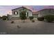 A well maintained front yard with desert landscaping and a charming one-story home at 35773 N Loemann Dr, San Tan Valley, AZ 85143