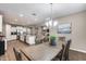 Open-concept kitchen and dining area with hardwood floors and abundant natural light at 35773 N Loemann Dr, San Tan Valley, AZ 85143