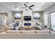 Open-concept living room with stylish furniture and natural light at 35773 N Loemann Dr, San Tan Valley, AZ 85143
