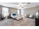 Spacious main bedroom with a seating area and a king size bed at 35773 N Loemann Dr, San Tan Valley, AZ 85143
