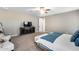 Spacious main bedroom with a TV and king size bed at 35773 N Loemann Dr, San Tan Valley, AZ 85143