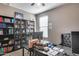 Home office featuring built-in shelves, a desk, and natural light at 35773 N Loemann Dr, San Tan Valley, AZ 85143
