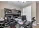 Spacious office featuring a large desk, storage, and ceiling fan at 35773 N Loemann Dr, San Tan Valley, AZ 85143