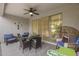 Cozy covered patio with comfortable seating, a ceiling fan, and seamless access to the home's interior at 35773 N Loemann Dr, San Tan Valley, AZ 85143