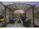 Charming pergola with comfortable seating, creating a private and inviting outdoor living space at 35773 N Loemann Dr, San Tan Valley, AZ 85143