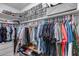 Large walk-in closet with shelves and hanging rods at 35773 N Loemann Dr, San Tan Valley, AZ 85143