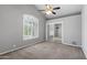 Bedroom with carpet, ceiling fan, and mirrored closet doors at 3822 E Florian Ave, Mesa, AZ 85206