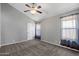 Bedroom with carpet, ceiling fan, and plenty of natural light from multiple windows at 3822 E Florian Ave, Mesa, AZ 85206