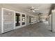 Covered patio with multiple ceiling fans and view to backyard pool at 3822 E Florian Ave, Mesa, AZ 85206