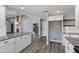 Open kitchen area with granite countertops and view into living area at 3822 E Florian Ave, Mesa, AZ 85206
