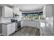 Bright, updated kitchen featuring white cabinets, granite countertops, and stainless steel appliances at 3822 E Florian Ave, Mesa, AZ 85206