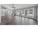 Large living room featuring tile floors, backyard access, and an open layout perfect for entertaining at 3822 E Florian Ave, Mesa, AZ 85206