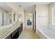 This bathroom features a double sink vanity, tub, and shower at 4107 W Mariposa Grande --, Glendale, AZ 85310