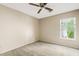 Bedroom with plush carpet, standard closet, ceiling fan, and window at 4107 W Mariposa Grande --, Glendale, AZ 85310