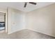 Bedroom with plush carpet, standard closet with folding doors, and ceiling fan at 4107 W Mariposa Grande --, Glendale, AZ 85310