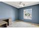 Bedroom with plush carpet, standard closet, ceiling fan, and neighborhood view at 4107 W Mariposa Grande --, Glendale, AZ 85310