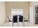 Well-lit dining area with tile flooring and a modern dining table at 4107 W Mariposa Grande --, Glendale, AZ 85310