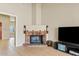 Bright living room with brick fireplace, tiled floors and a cozy atmosphere at 4107 W Mariposa Grande --, Glendale, AZ 85310