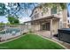 Expansive backyard includes a covered patio, fenced pool, and artificial grass at 4226 E Stanford Ave, Gilbert, AZ 85234