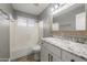 Bathroom featuring vanity, sink, framed mirror, and shower and tub combination at 4226 E Stanford Ave, Gilbert, AZ 85234