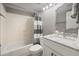 Clean bathroom with tub, shower, white vanity, and granite countertop at 4226 E Stanford Ave, Gilbert, AZ 85234