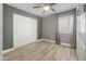 Cozy bedroom featuring a ceiling fan, sliding closet doors, and ample natural light at 4226 E Stanford Ave, Gilbert, AZ 85234