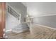 Bright entryway features tile flooring, staircase with wrought iron spindles, and views into open living space at 4226 E Stanford Ave, Gilbert, AZ 85234