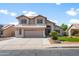 Charming two-story home with neutral color scheme, well-maintained landscaping, and spacious driveway leading to garage at 4226 E Stanford Ave, Gilbert, AZ 85234
