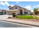 Inviting two-story home boasts a well-manicured lawn, beautiful landscaping, and a spacious two car garage at 4226 E Stanford Ave, Gilbert, AZ 85234