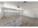 Spacious three-car garage with finished floors and ample lighting at 4226 E Stanford Ave, Gilbert, AZ 85234