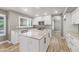 Modern kitchen features granite countertops, stainless steel appliances, island, and white cabinets at 4226 E Stanford Ave, Gilbert, AZ 85234