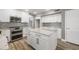 Elegant kitchen features white cabinetry, granite countertops, stainless steel appliances, and tile backsplash at 4226 E Stanford Ave, Gilbert, AZ 85234