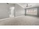 Large living room with plush carpet, white trim and natural lighting at 4226 E Stanford Ave, Gilbert, AZ 85234