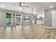 Open-concept living area leading to kitchen with stainless appliances at 4226 E Stanford Ave, Gilbert, AZ 85234