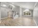 Spacious and open-concept living area featuring tiled floors, high ceilings, staircase, and abundant natural light at 4226 E Stanford Ave, Gilbert, AZ 85234