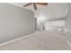 Upstairs loft area with plush carpet and white staircase railing at 4226 E Stanford Ave, Gilbert, AZ 85234
