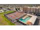 Aerial shot of community with pickleball and pool: pickleball courts and a refreshing pool surrounded by lounge chairs at 4655 E Farmdale Ave, Mesa, AZ 85206