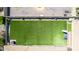 Aerial view of the backyard, showcasing artificial turf and an enclosed patio, providing privacy and space at 4655 E Farmdale Ave, Mesa, AZ 85206