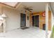 This covered back porch features ceiling fan, tile floors, and outdoor access at 4655 E Farmdale Ave, Mesa, AZ 85206