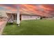 Backyard features artificial grass, a swing, and a covered patio, ideal for enjoying the outdoors at 4655 E Farmdale Ave, Mesa, AZ 85206