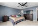 Cozy bedroom with carpet, ceiling fan, and a window offering ample natural light at 4655 E Farmdale Ave, Mesa, AZ 85206