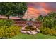 Sunland Village sign with rock waterfall feature and lush landscaping at 4655 E Farmdale Ave, Mesa, AZ 85206