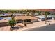Charming single-story home with desert landscaping, lush palm trees, and attached two-car garage at 4655 E Farmdale Ave, Mesa, AZ 85206