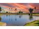 Beautiful golf course pond with a water fountain and lush green surroundings at 4655 E Farmdale Ave, Mesa, AZ 85206