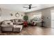 Bright living room featuring ceiling fan, wood-look flooring and an abundance of natural light at 4655 E Farmdale Ave, Mesa, AZ 85206